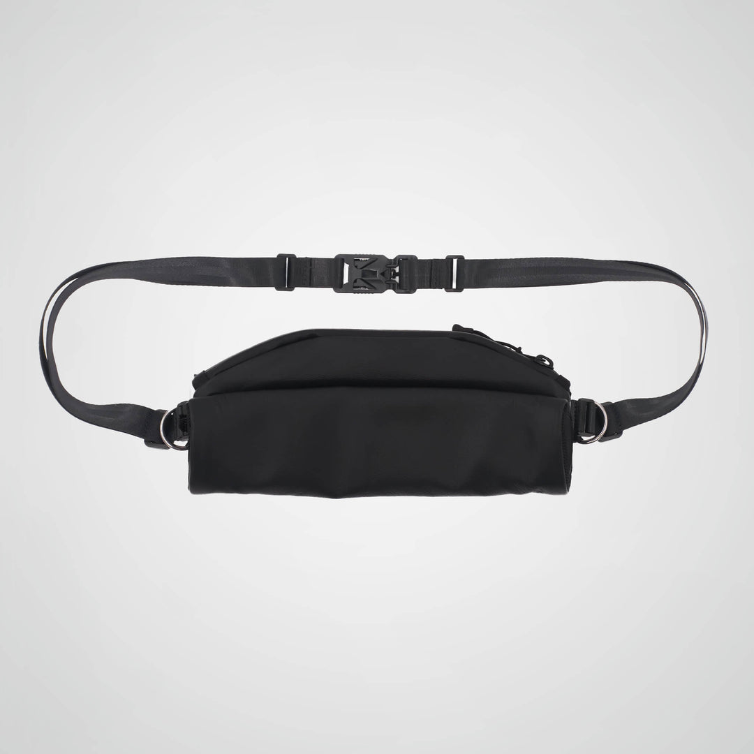 Black waist bag with a strap on a light gray background