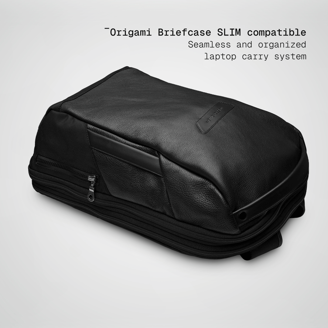 Slim briefcase sliding into the black leather Vector Speed Backpack