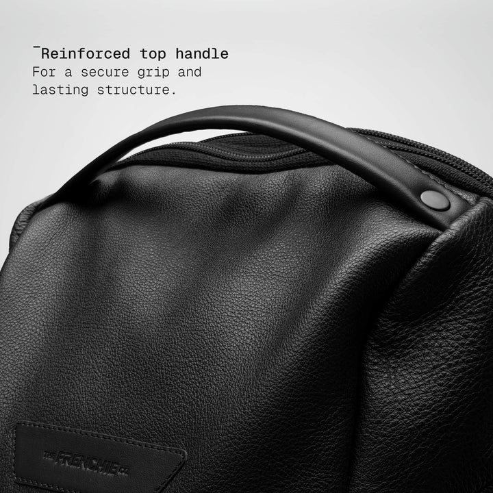 Top handle detail on the black leather Vector Speed Backpack