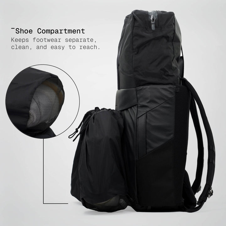 Black backpack with shoe compartment feature on a white background