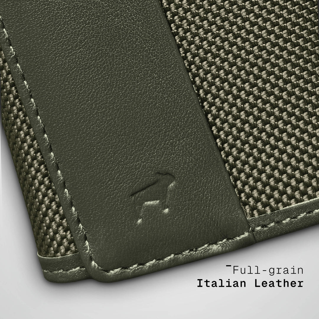 Green leather wallet with textured fabric backing on a light gray background