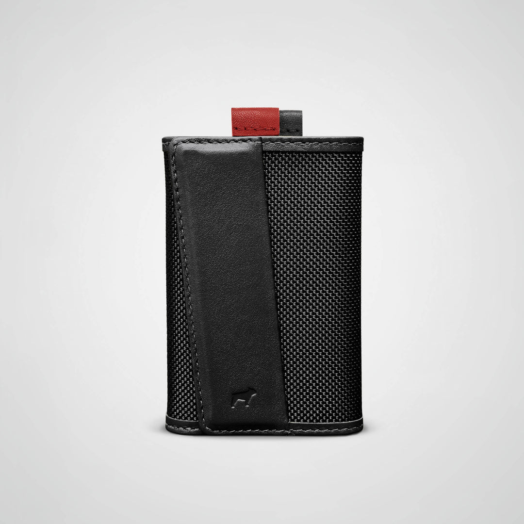 Black leather wallet with a textured pattern on a light gray background
