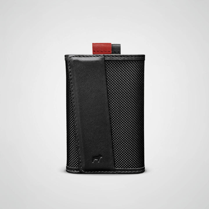 Black leather wallet with a textured pattern on a light gray background