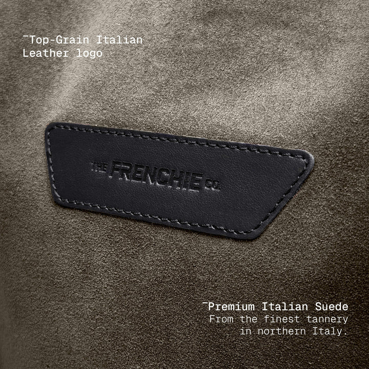 Embossed logo detail on taupe suede