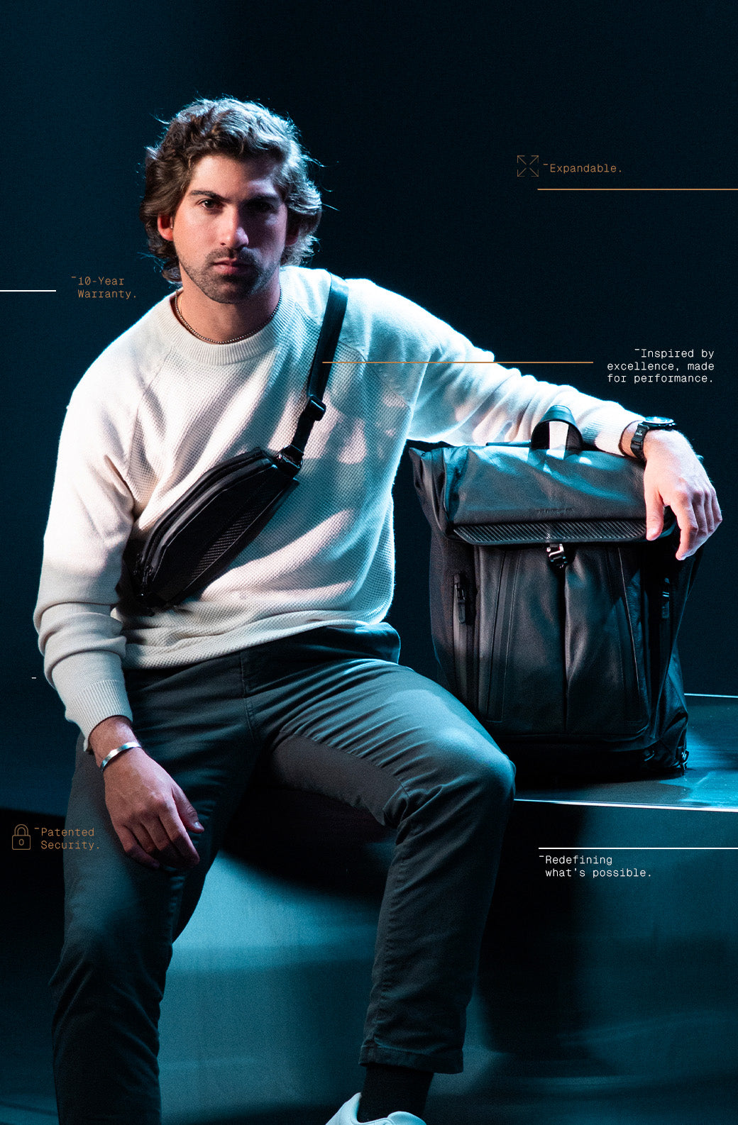 Man sitting with bags on a dark background