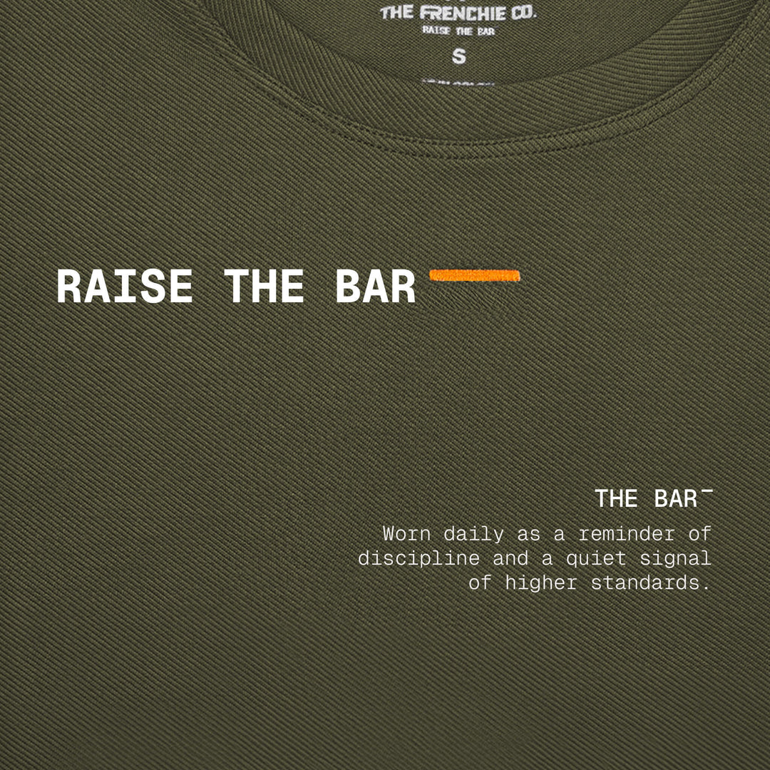 RAISE THE BAR — Camiseta Manga Corta